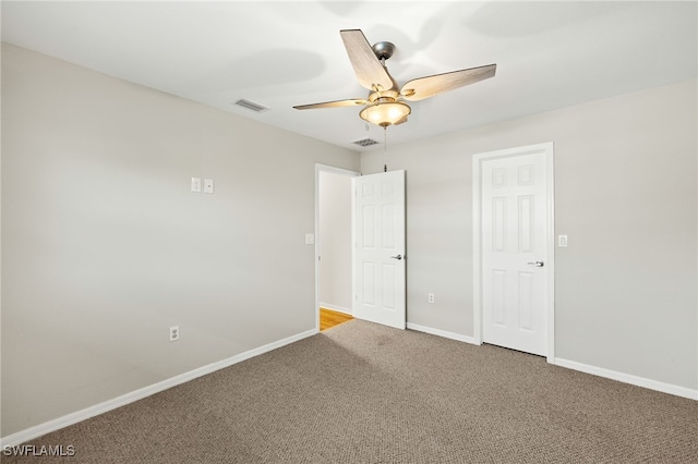 19897 Midway Blvd, Port Charlotte, FL 33948 - carpeted empty room with baseboards and a ceiling fan