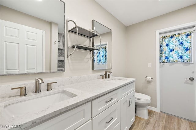 19897 Midway Blvd, Port Charlotte, FL 33948 - bathroom featuring double vanity and wood finished floors