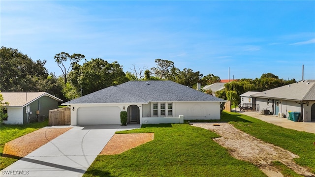 19897 Midway Blvd, Port Charlotte, FL 33948 - ranch-style home featuring a front yard, a garage, driveway, and stucco siding