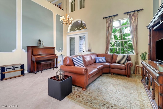 5730 Lago Villaggio Way, Naples, FL 34104 - tiled living area with a chandelier and a towering ceiling