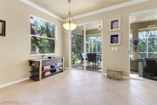 5730 Lago Villaggio Way, Naples, FL 34104 - dining space with ornamental molding, healthy amount of natural light, tile patterned flooring, and ceiling fan