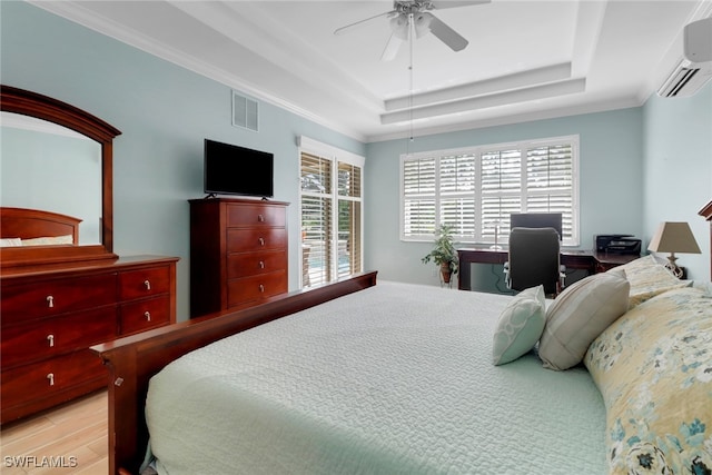 5730 Lago Villaggio Way, Naples, FL 34104 - bedroom with a wall unit AC, a raised ceiling, an office area, and a ceiling fan