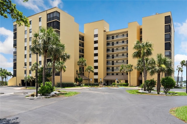 400 E Lenell Unit 110, Fort Myers Beach, FL 33931 - view of apartment building / complex with uncovered parking