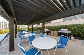 400 E Lenell Unit 110, Fort Myers Beach, FL 33931 - view of patio featuring outdoor dining area