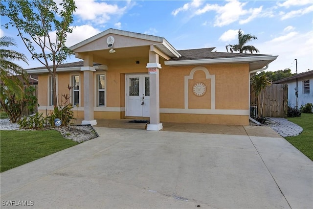 770 93rd Ave N, Naples, FL 34108 - view of front facade with stucco siding