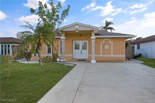 770 93rd Ave N, Naples, FL 34108 - view of front facade with stucco siding and driveway
