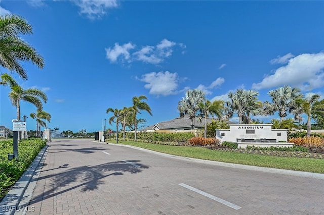 4720 Arboretum Cir Unit 102, Naples, FL 34112 - view of decorative street with curbs and a gated entry