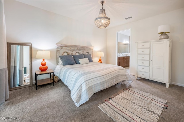 4720 Arboretum Cir Unit 102, Naples, FL 34112 - bedroom featuring carpet, connected bathroom, and a chandelier