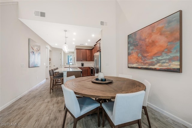 4720 Arboretum Cir Unit 102, Naples, FL 34112 - dining area featuring light wood-style floors and recessed lighting