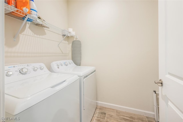 4720 Arboretum Cir Unit 102, Naples, FL 34112 - laundry room featuring washer and clothes dryer and baseboards
