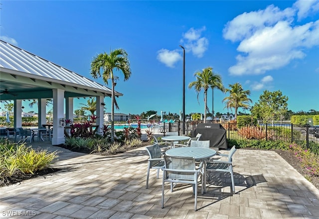 4720 Arboretum Cir Unit 102, Naples, FL 34112 - view of patio with grilling area, a gazebo, and a community pool