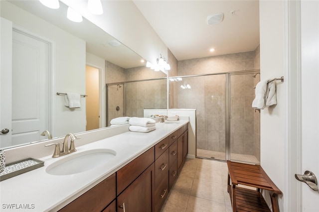 4720 Arboretum Cir Unit 102, Naples, FL 34112 - full bath with double vanity, tile patterned flooring, and a stall shower