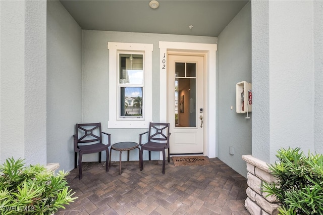 4720 Arboretum Cir Unit 102, Naples, FL 34112 - view of exterior entry with stucco siding