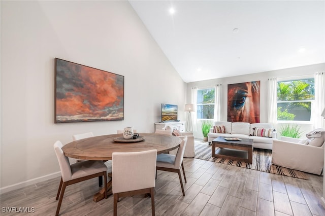 4720 Arboretum Cir Unit 102, Naples, FL 34112 - dining area with high vaulted ceiling and wood finished floors