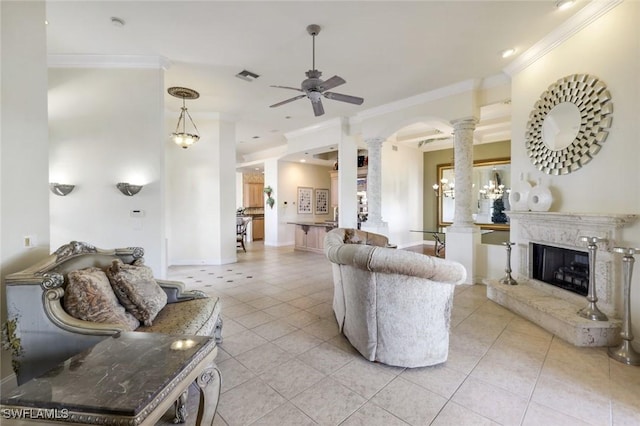 14581 Headwater Bay Ln, Fort Myers, FL 33908 - living area featuring ornate columns, ceiling fan, crown molding, light tile patterned flooring, and a premium fireplace