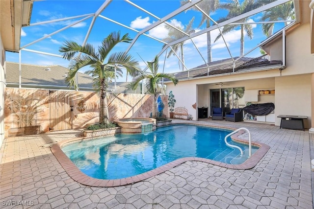 14581 Headwater Bay Ln, Fort Myers, FL 33908 - view of pool with a ceiling fan, a patio area, a pool with connected hot tub, and glass enclosure