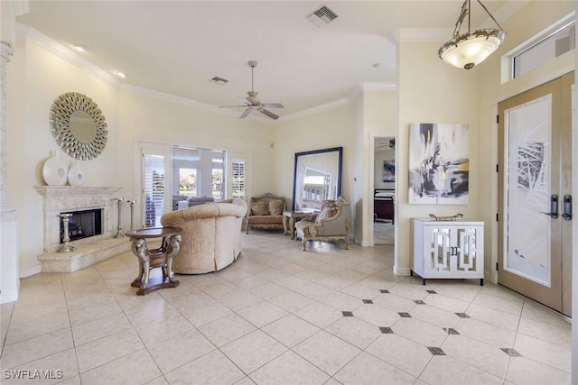 14581 Headwater Bay Ln, Fort Myers, FL 33908 - living room with ornamental molding, ceiling fan, light tile patterned floors, and a fireplace with raised hearth