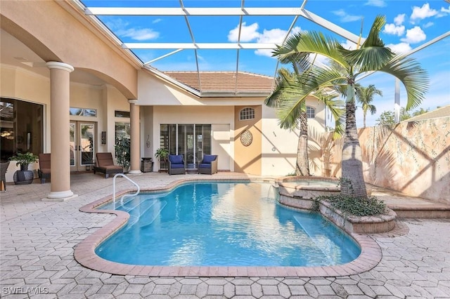 14581 Headwater Bay Ln, Fort Myers, FL 33908 - view of pool with a patio, a lanai, a pool with connected hot tub, and french doors