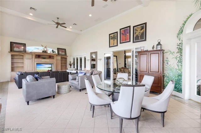 14581 Headwater Bay Ln, Fort Myers, FL 33908 - dining space featuring a ceiling fan, high vaulted ceiling, light tile patterned floors, recessed lighting, and a fireplace