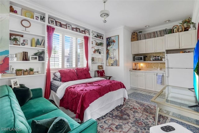 14581 Headwater Bay Ln, Fort Myers, FL 33908 - bedroom featuring crown molding and freestanding refrigerator
