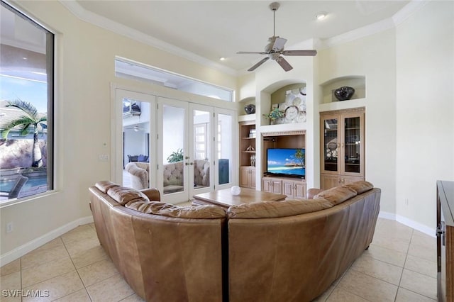 14581 Headwater Bay Ln, Fort Myers, FL 33908 - living area featuring built in features, light tile patterned floors, french doors, crown molding, and a ceiling fan
