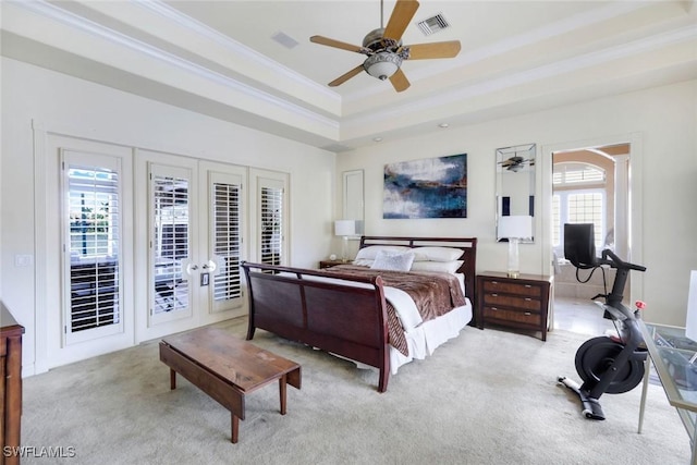 14581 Headwater Bay Ln, Fort Myers, FL 33908 - bedroom with french doors, a tray ceiling, access to exterior, light carpet, and crown molding