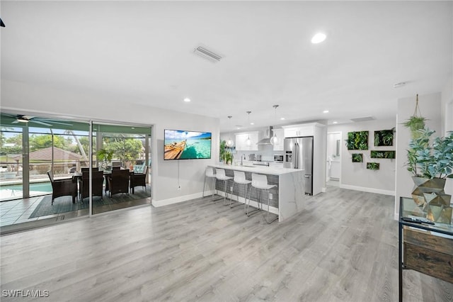1138 Lucerne Ave, Cape Coral, FL 33904 - living area with recessed lighting, light wood finished floors, and ceiling fan