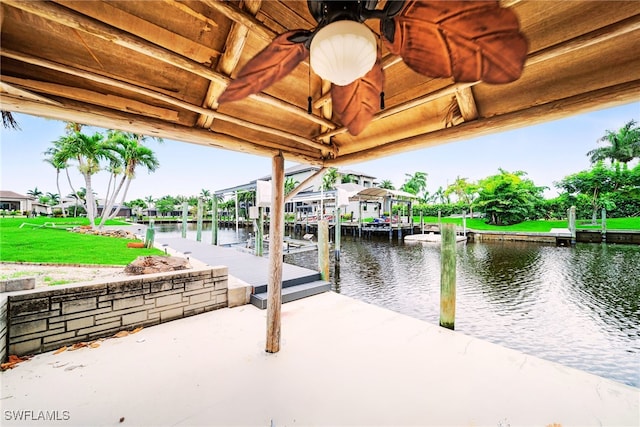 1138 Lucerne Ave, Cape Coral, FL 33904 - dock featuring a water view, boat lift, and a yard