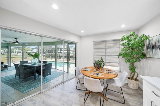 1138 Lucerne Ave, Cape Coral, FL 33904 - dining space with light wood-style floors, plenty of natural light, a ceiling fan, and recessed lighting