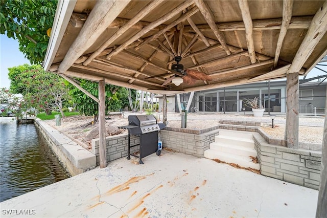 1138 Lucerne Ave, Cape Coral, FL 33904 - view of patio / terrace featuring a water view, ceiling fan, and grilling area