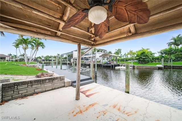 1138 Lucerne Ave, Cape Coral, FL 33904 - dock area featuring boat lift, a water view, and a yard