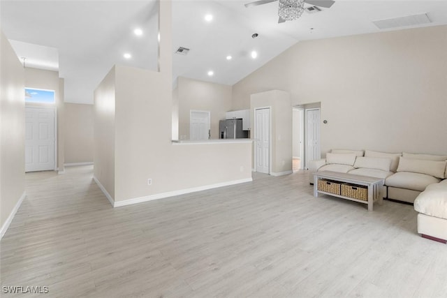 2811 44th St W, Lehigh Acres, FL 33971 - living room featuring a ceiling fan, light wood finished floors, high vaulted ceiling, and recessed lighting