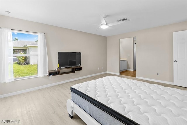 2811 44th St W, Lehigh Acres, FL 33971 - bedroom with wood finished floors, multiple windows, and a ceiling fan
