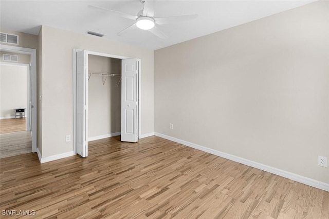 2811 44th St W, Lehigh Acres, FL 33971 - unfurnished bedroom featuring light wood finished floors, a closet, and ceiling fan
