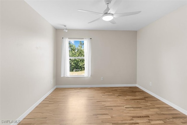 2811 44th St W, Lehigh Acres, FL 33971 - empty room with light wood finished floors and a ceiling fan