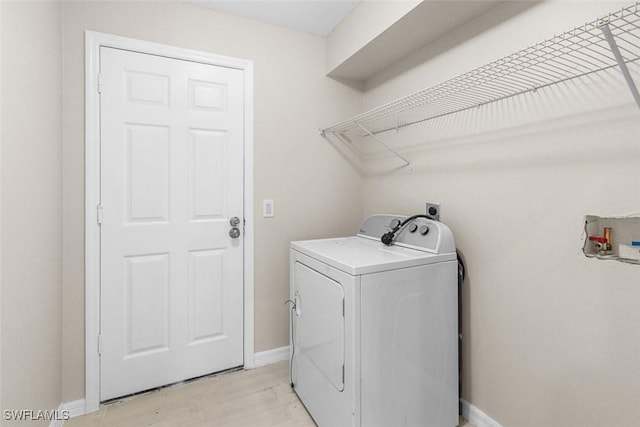 2811 44th St W, Lehigh Acres, FL 33971 - laundry area featuring hookup for an electric dryer and light wood finished floors