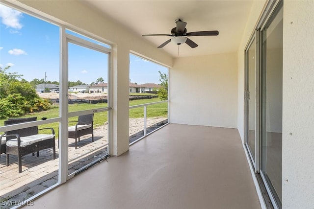 2811 44th St W, Lehigh Acres, FL 33971 - unfurnished sunroom with a ceiling fan and a residential view