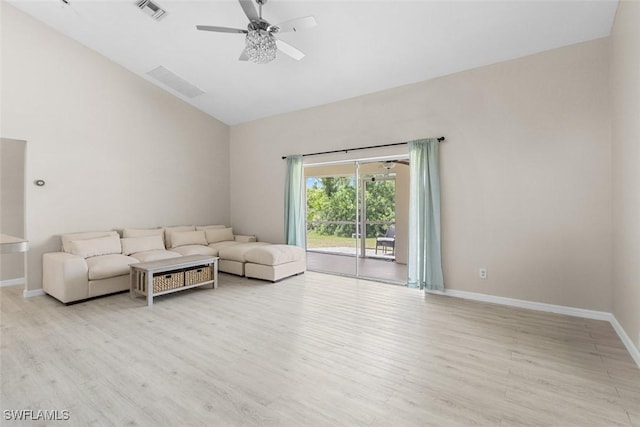 2811 44th St W, Lehigh Acres, FL 33971 - living room featuring light wood-style floors, a ceiling fan, and high vaulted ceiling