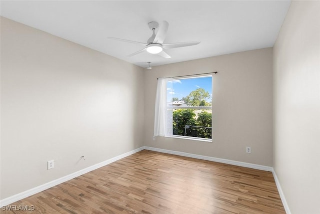 2811 44th St W, Lehigh Acres, FL 33971 - unfurnished room featuring wood finished floors and a ceiling fan