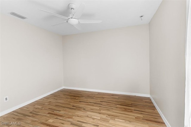 2811 44th St W, Lehigh Acres, FL 33971 - spare room featuring wood finished floors and a ceiling fan