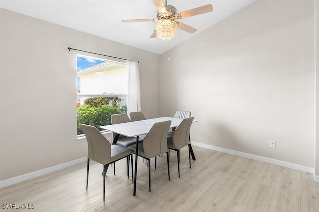 2811 44th St W, Lehigh Acres, FL 33971 - dining space featuring wood finished floors, ceiling fan, and vaulted ceiling