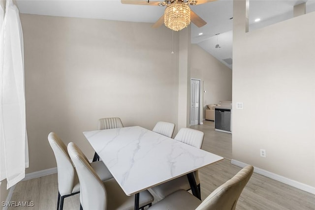 2811 44th St W, Lehigh Acres, FL 33971 - dining area with ceiling fan, light wood-type flooring, high vaulted ceiling, and recessed lighting