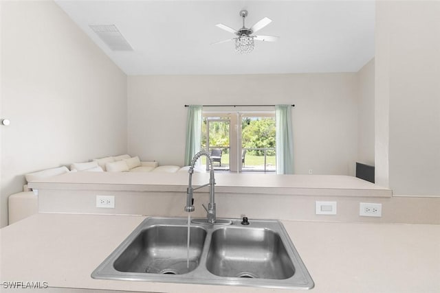 2811 44th St W, Lehigh Acres, FL 33971 - kitchen with light countertops, open floor plan, and a ceiling fan