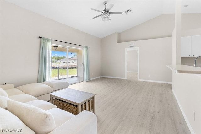 2811 44th St W, Lehigh Acres, FL 33971 - living area featuring light wood finished floors, a ceiling fan, and high vaulted ceiling