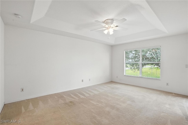 4322 NW 32nd Ter, Cape Coral, FL 33993 - empty room with a tray ceiling, a ceiling fan, light carpet, and a smoke detector