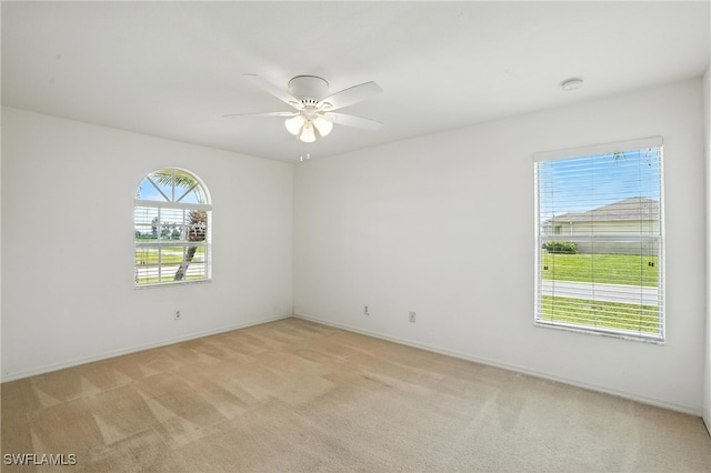 4322 NW 32nd Ter, Cape Coral, FL 33993 - empty room featuring light carpet, ceiling fan, and a smoke detector