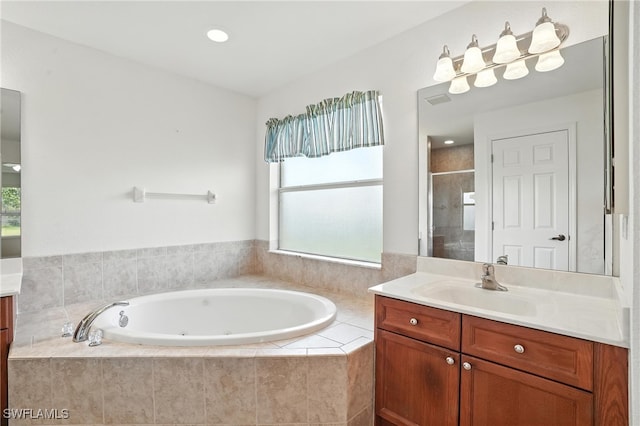 4322 NW 32nd Ter, Cape Coral, FL 33993 - bathroom with vanity, a whirlpool tub, and a shower stall