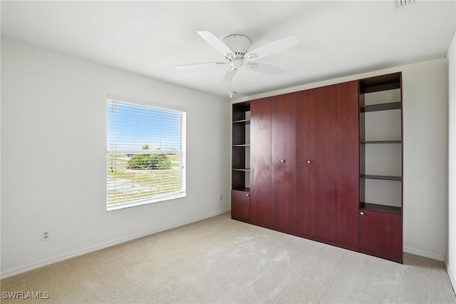 4322 NW 32nd Ter, Cape Coral, FL 33993 - unfurnished bedroom with a closet, carpet, and ceiling fan