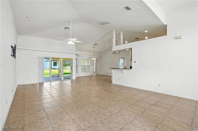 4322 NW 32nd Ter, Cape Coral, FL 33993 - unfurnished living room featuring a ceiling fan, light tile patterned floors, recessed lighting, and high vaulted ceiling
