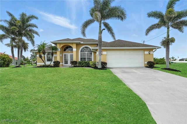 4322 NW 32nd Ter, Cape Coral, FL 33993 - view of front of home with french doors, stucco siding, driveway, a garage, and a front yard